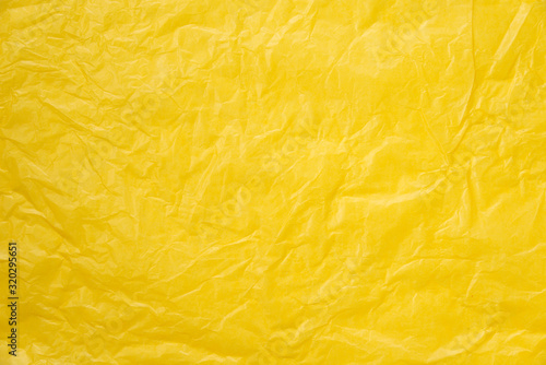 abstract background yellow crumpled transparent paper on white paper. o