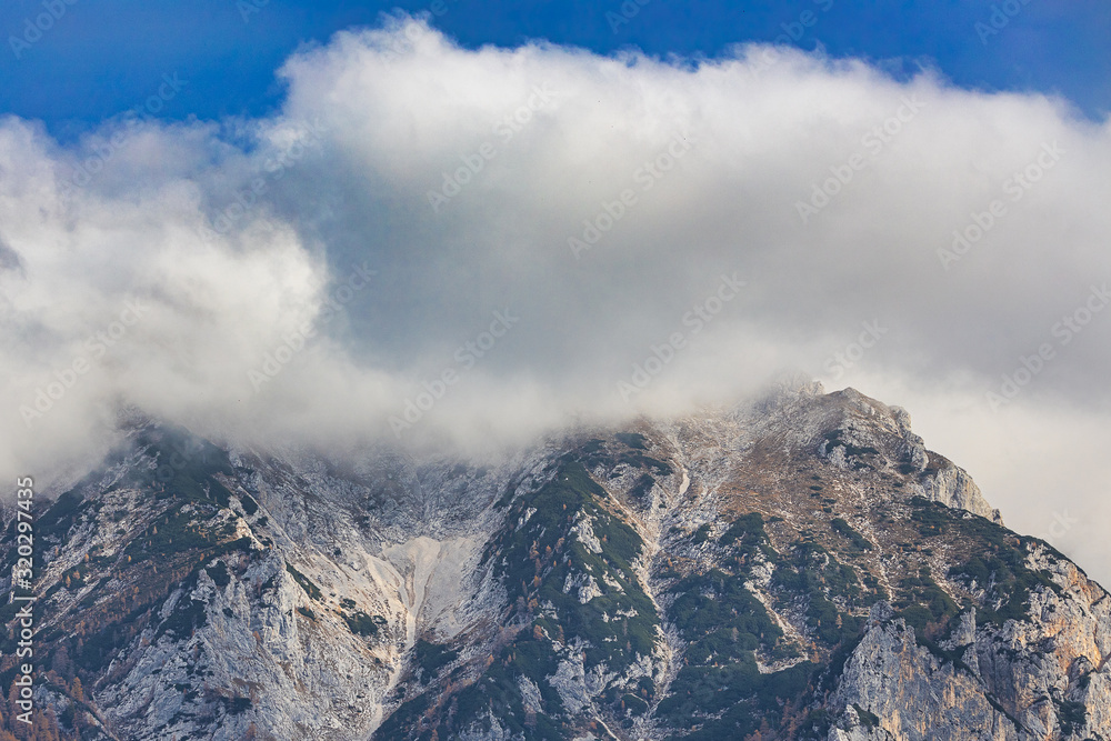 Slovenian alps in autumn season covered with clouds