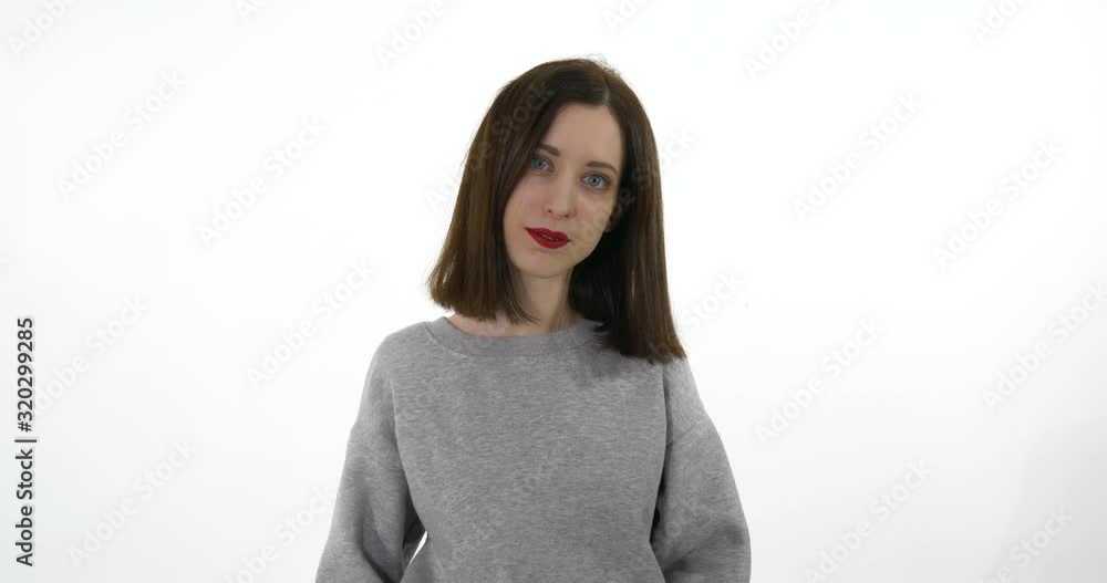 Beautiful Young blue eyes Girl looking to the camera, smiling, putting hands together. Beautiful Young blue eyes Girl looking to the camera, smiling, putting hands together.