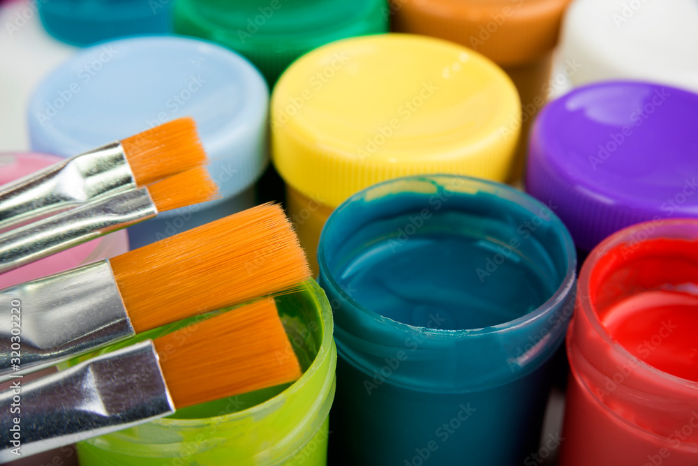 Details of colorful school paints and brushes Details of colorful school paints and brushes