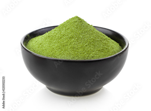 instant matcha green tea inblack bowl on white photo