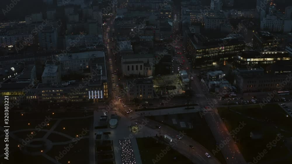 Aerial view of skyscrapers at dusk and city traffic in the center of Warsaw. Poland. Drone flies towards the glass skyscrapers at night. 4K Shot. Aerial view of skyscrapers at dusk and city traffic in the center of Warsaw. Poland. Drone flies towards the glass skyscrapers at night. 4K Shot.