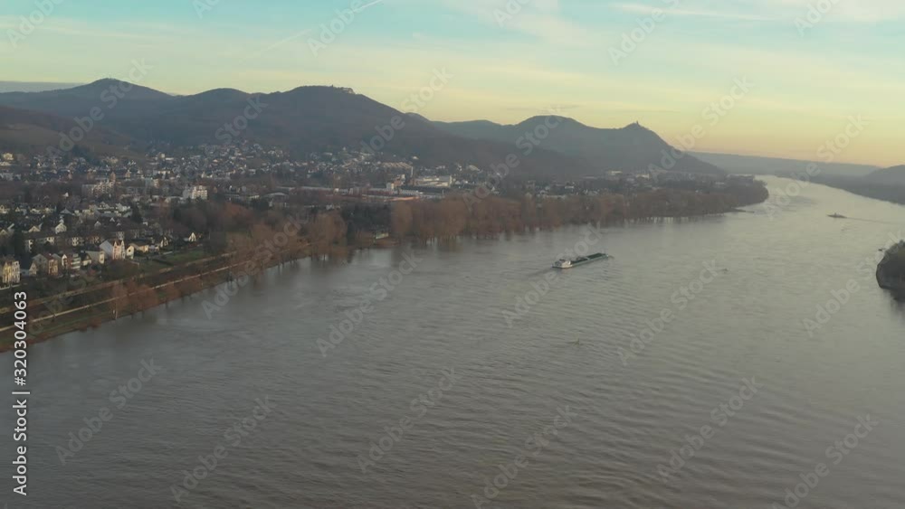 Cinematic drone /aerial shot of the river rhine with a ship and the panorama of the seven mountains / Siebengebirge Königswinter / Bonn at golden hour, 25p Cinematic drone /aerial shot of the river rhine with a ship and the panorama of the seven mountains / Siebengebirge Königswinter / Bonn at golden hour, 25p