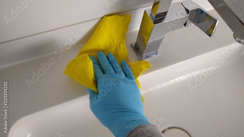 Household - cleaning the bathroom - cleaning - home cleaning - hand with yellow rag