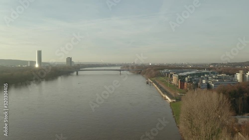 Wallpaper Mural Cinematic drone / aerial shot of the river rhine in bonn königswinter with the post tower the Kameha Grand Hotel and the konrad adenauer bridge at the golden hour afternoon, 25p Torontodigital.ca