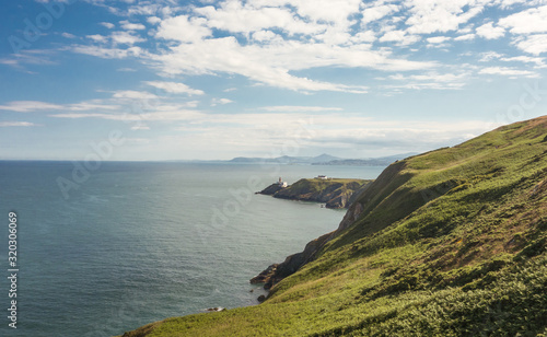 View of Dublin Bay from Howth Head peninsula near Dublin, Ireland. The Bailey Lighthouse is in the midground and Bray Head in the background. © Alasabyss
