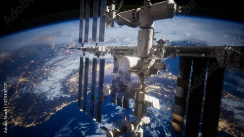 A view of the Earth and a spaceship. International space station is orbiting the Earth, Elements furnished by NASA. photo