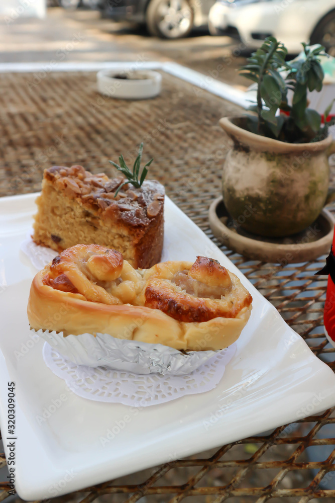 bun , banana cake and hot coffee