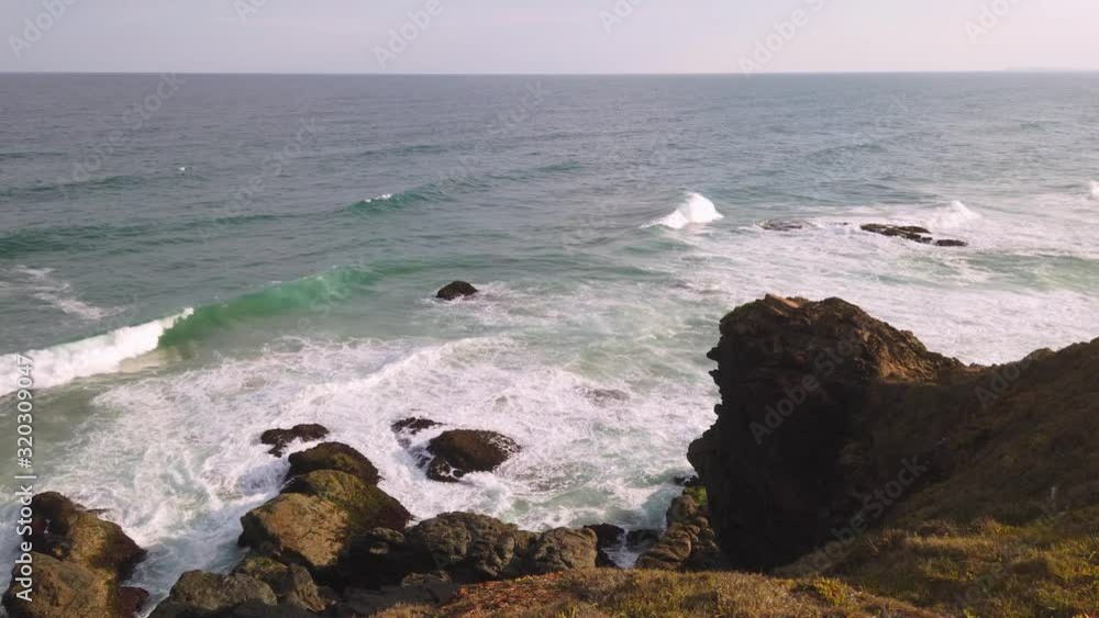 Big waves crashing into rocks on Pacific Ocean Big waves crashing into rocks on Pacific Ocean