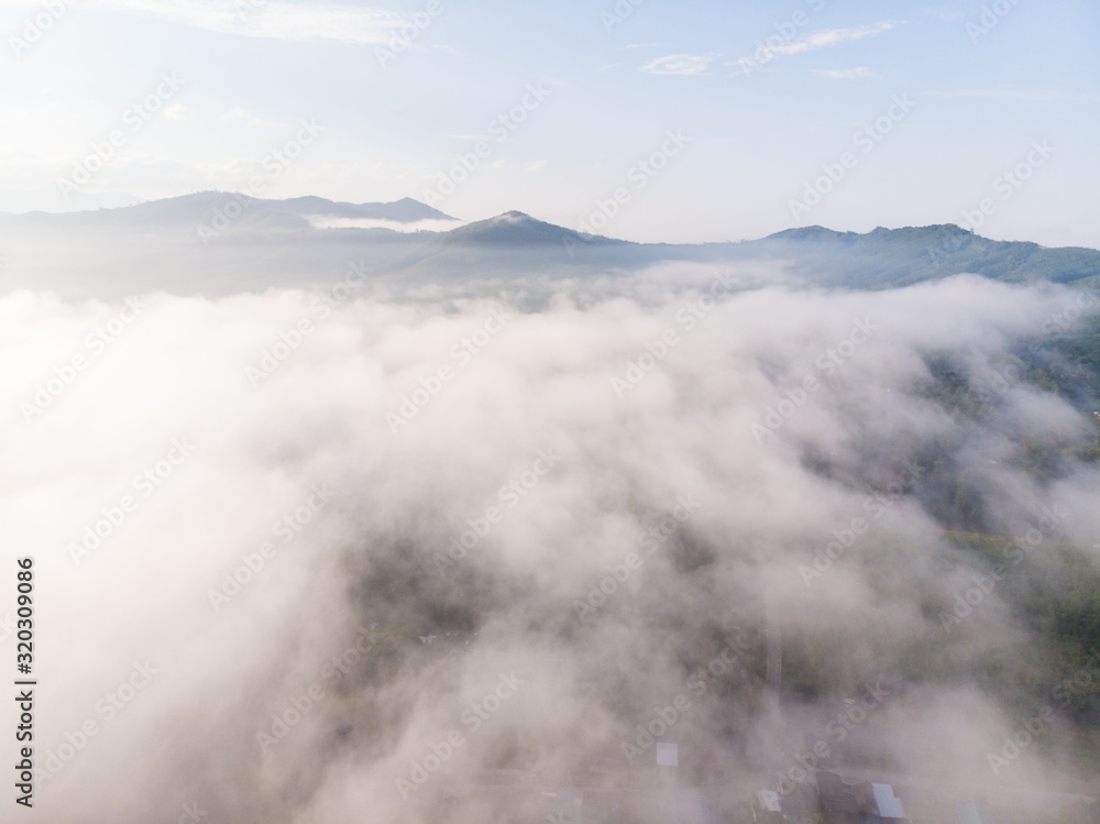 Aerial view morning sunrise with fog on mountain