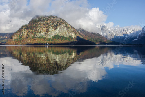 The clear water of Hallstattersee lake and the beautiful mountains surrounding it in Salzkammergut region  Austria  in winter