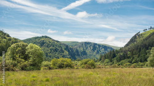 Mountain, woodland landscape at Glendalough National Park, County Wicklow, Ireland.