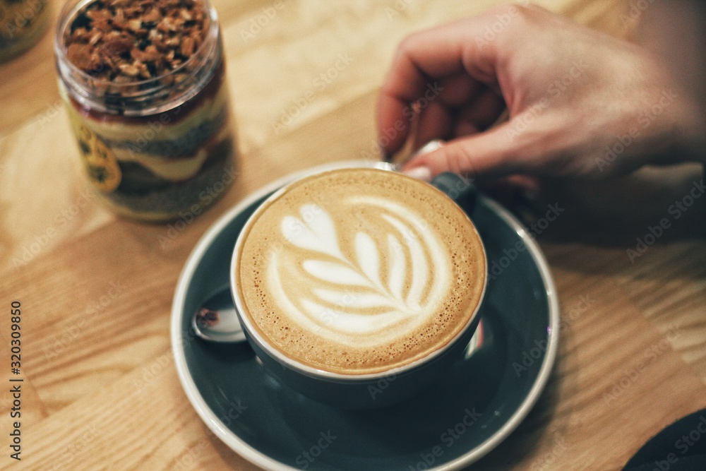 Close up of female hands holding coffee mug