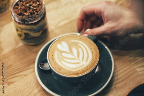 Close up of female hands holding coffee mug