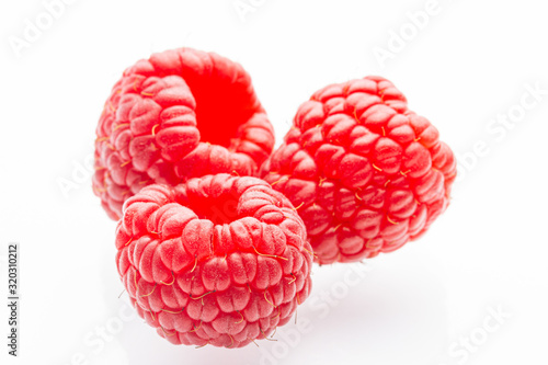 Ripe raspberries on a white background. Berries. Garden raspberries. White background. Red berries. Isolated.