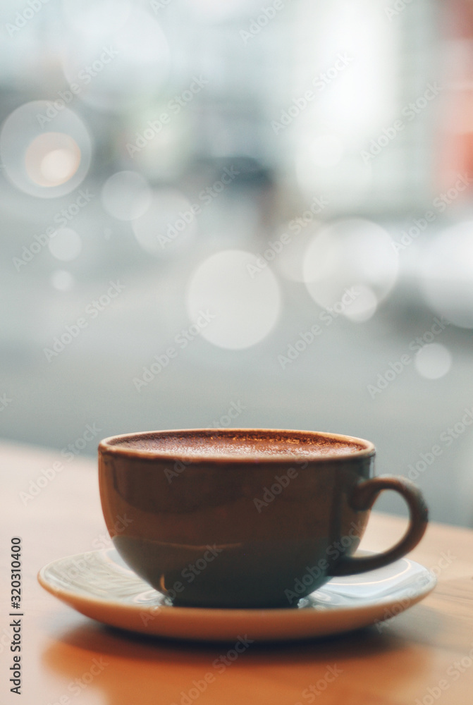 Close up of coffee mug, cup with blured background and bokeh