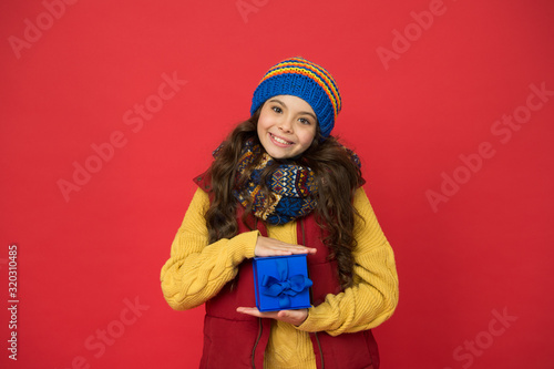 Fashion shop. Winter fashion. Hipster fashion trend. Happy winter holidays activity. Feeling warm and happy. Comfy style. Cheerful smiling child long hair in stylish outfit. Winter wardrobe