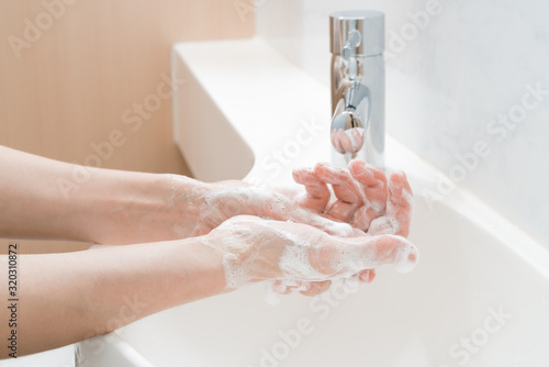  Asian woman washing hands 