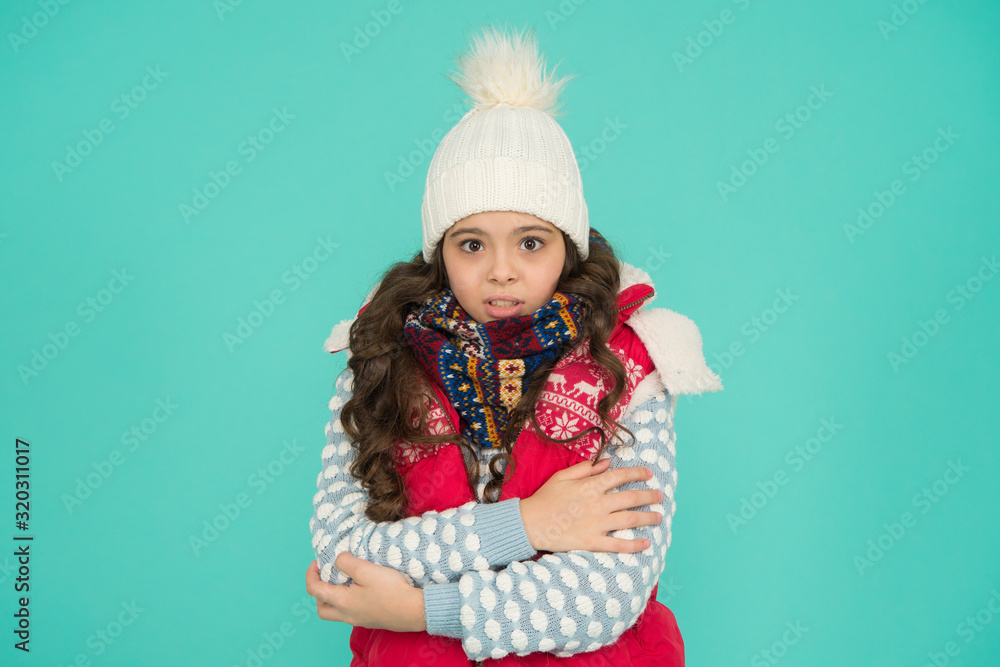 Stay active. it is cold outside. kid warm knitwear. winter vibes. Portrait of girl hipster. Youth street fashion. Winter flue. feeling cold this season. Dress in layers and wear hat. Winter dreaming