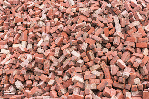 Background of randomly lying red bricks