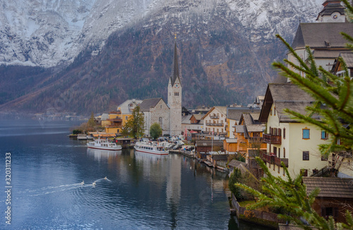 Hallstatt, a charming village on the Hallstattersee lake and a famous tourist attraction, with beautiful mountains surrounding it, in Salzkammergut region, Austria, in winter sunny day. © Aron M  - Austria