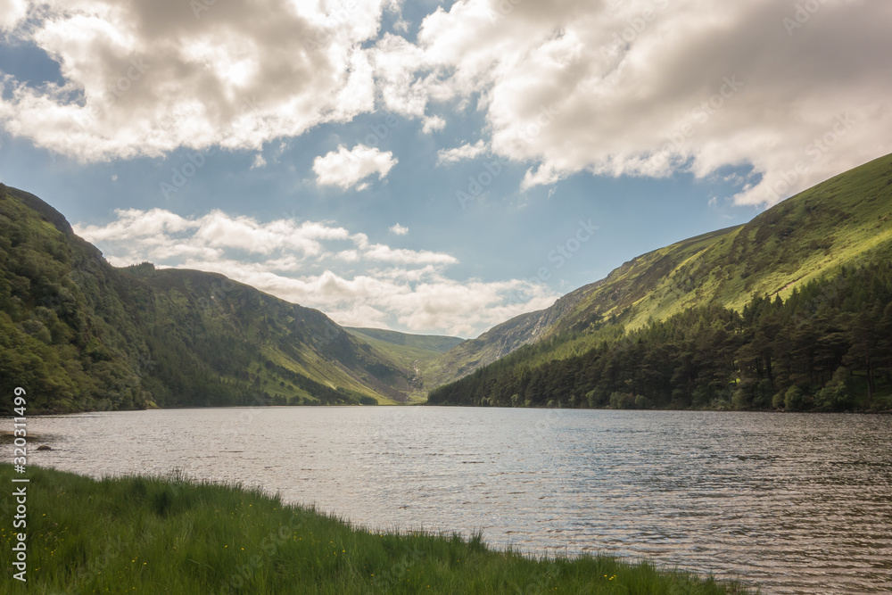 Upper Lake at Glendalough, County Wicklow, Ireland. The Glendalough valley is located in Wicklow Mountains National Park and is home to an Early Medieval monastic settlement.
