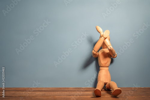 Violence and manipulation. sad wooden dummy
