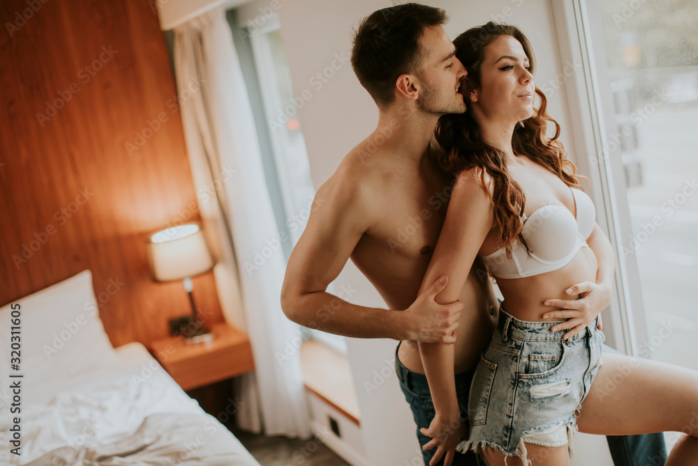 Young couple standing in the room Young couple standing in the room
