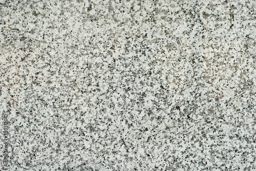Black and white marble texture. Stone tile with natural pattern. Marble pavement closeup. A small marble crumb.
