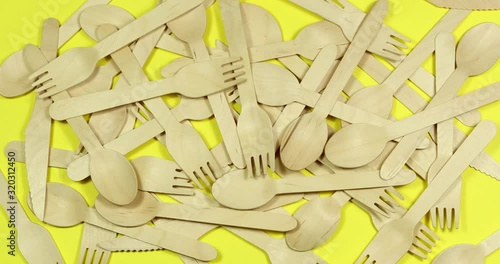 Stop motion Disposable appliance background for a meal of wood. Eco concept.
