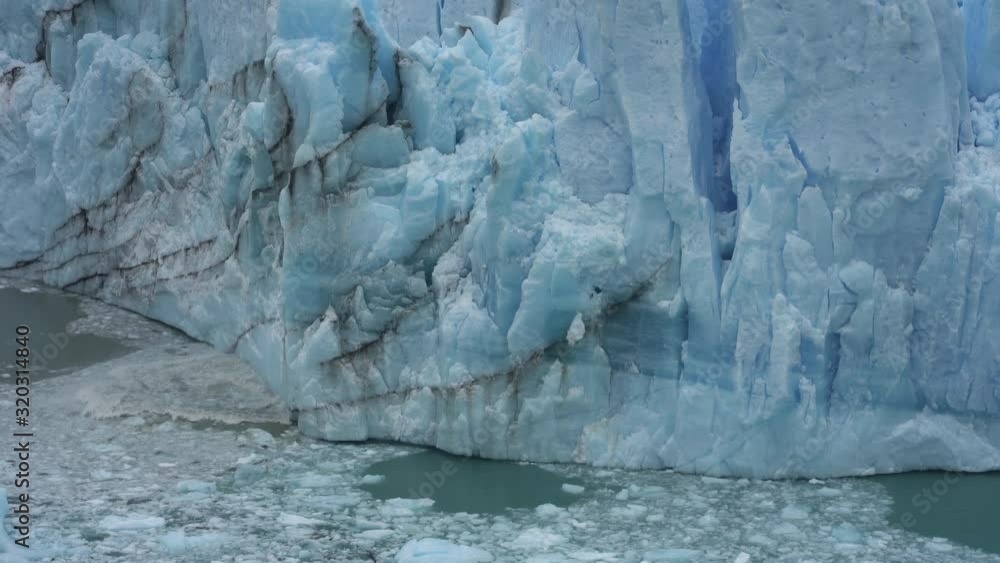 Pieces of Ice From Glacier Calving and Splashing Ocean Water. Ecosystem, Climate Change and Global Warming Concept Pieces of Ice From Glacier Calving and Splashing Ocean Water. Ecosystem, Climate Change and Global Warming Concept