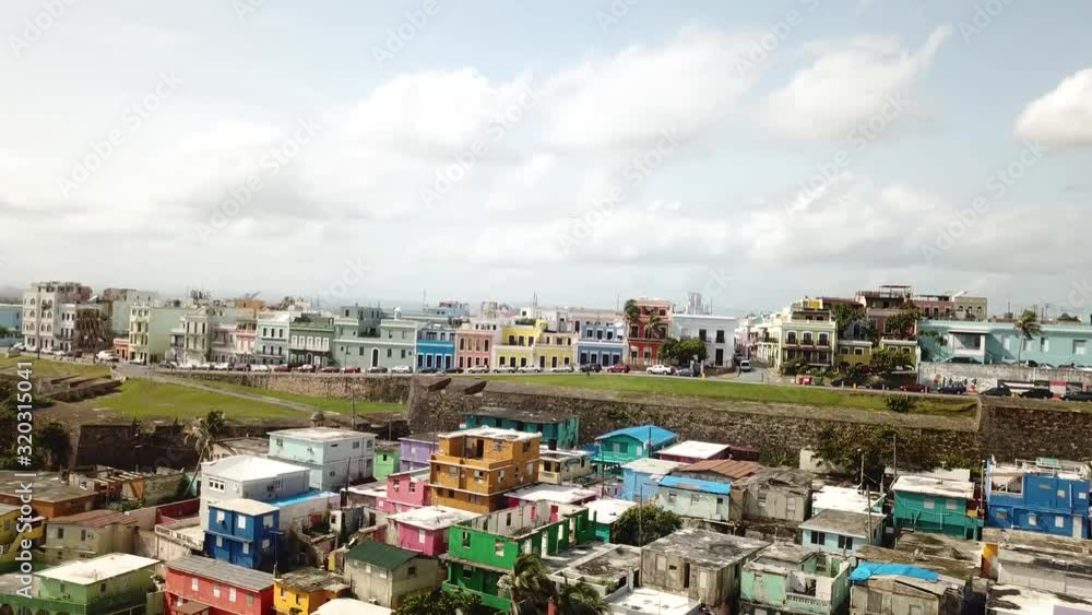 Pull Back Aerial View of La Perla, Shanty and Colorful District of San Juan Puerto Rico on Atlantic Ocean Coastline Pull Back Aerial View of La Perla, Shanty and Colorful District of San Juan Puerto Rico on Atlantic Ocean Coastline