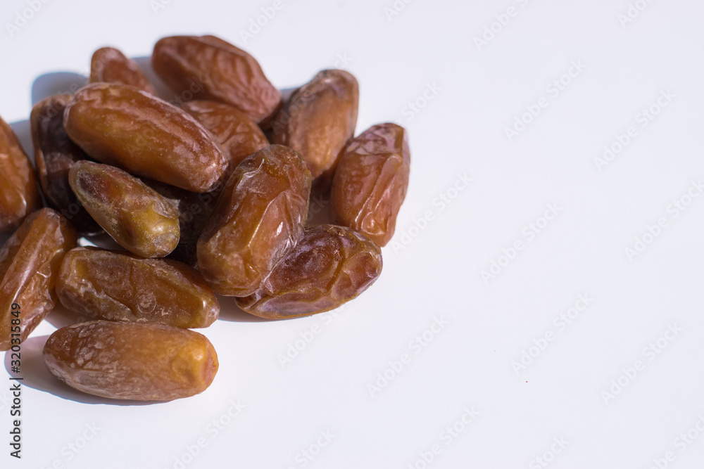 dried dates palm on white background dried dates palm on white background