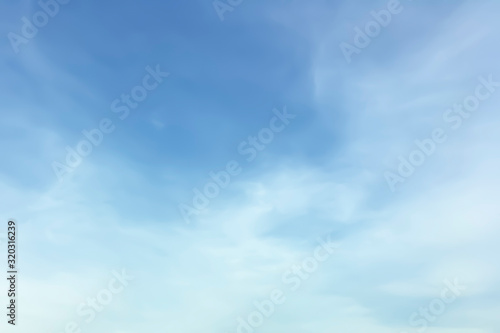 Beautiful freshness morning bright blue sky and blurry soft white clouds background in summer tropical season.