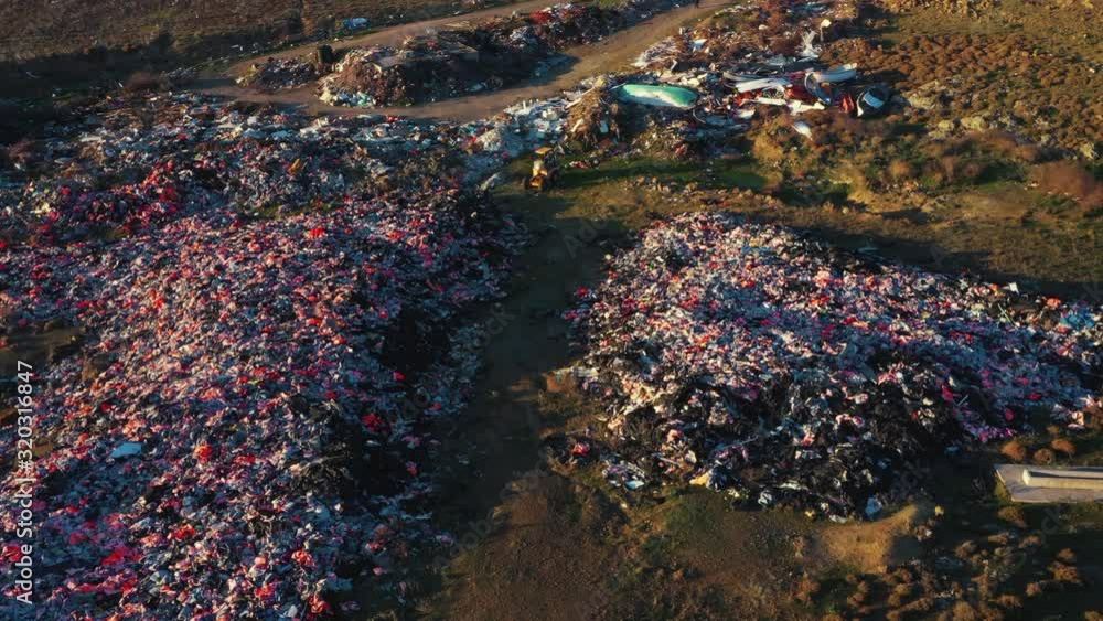 Ascending aerial over refugee lifejacket dump Lesvos Ascending aerial over refugee lifejacket dump Lesvos