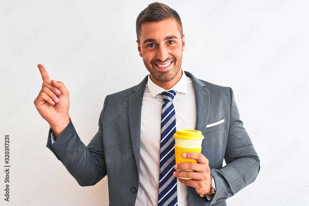 Young handsome business man drinking take away coffee over isolated background very happy pointing with hand and finger to the side Young handsome business man drinking take away coffee over isolated background very happy pointing with hand and finger to the side