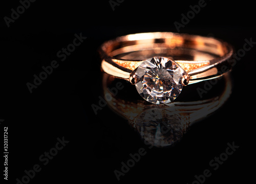 Wedding ring on black background