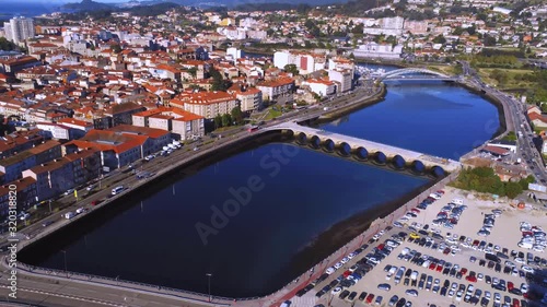 Aerial lanscape, coastal cityscape and bridges. Puente de las Corrientes, Ponte do Burgo crossing the river Ría de Pontevedra. photo