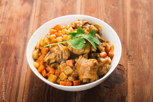 Chicken with potato and carrot in curry,