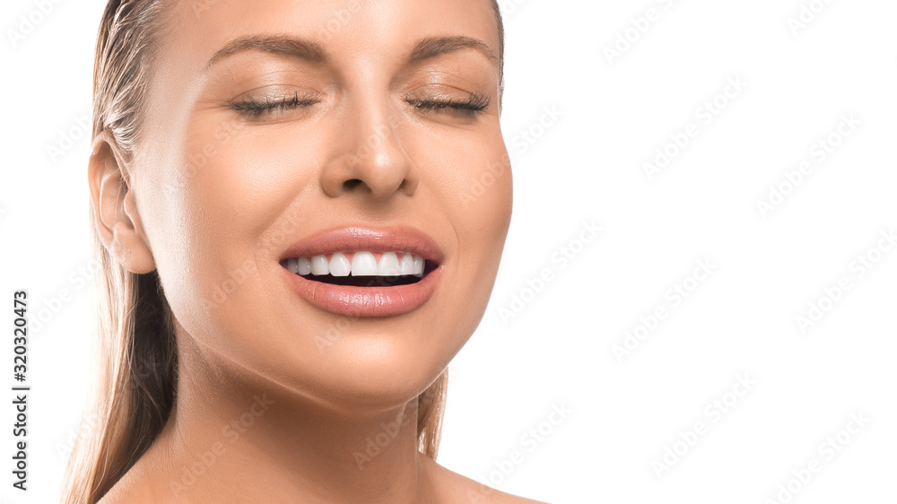 Close up portrait of a smiling woman with closed eyes over white background. Close up portrait of a smiling woman with closed eyes over white background.