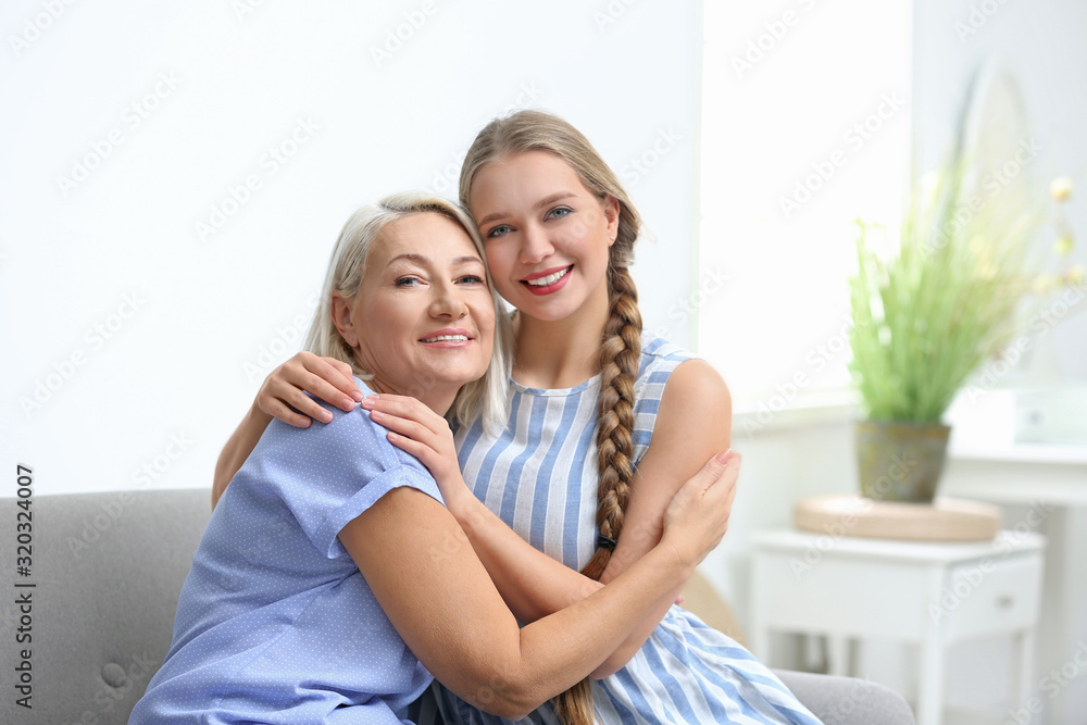Mother and her adult daughter spending time together at home Mother and her adult daughter spending time together at home