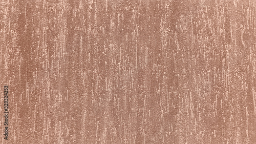 Copper metallic grunge texture. Brown painted surface. Old textured wall. Surface of plaster, stucco, colorful concrete. Rough cracked background. Close up, top view.