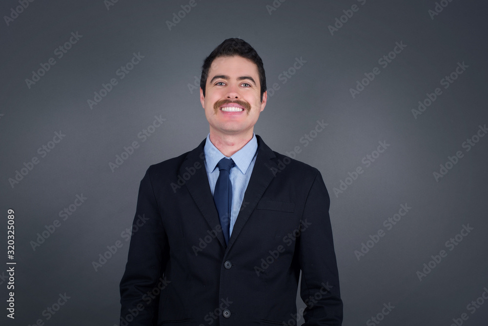Horizontal portrait of pleasant-looking Caucasian male wearing casual clothes looking happily to the camera. Horizontal portrait of pleasant-looking Caucasian male wearing casual clothes looking happily to the camera.