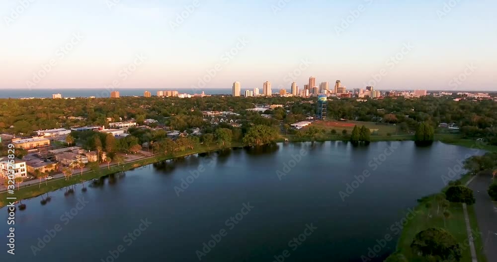 4K Aerial Video Tilt Up from Crescent Lake to Downtown St Petersburg Skyline