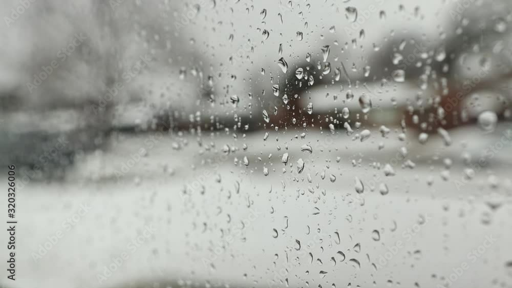 Raindrops Running Down Window on a Rainy Winter Day Raindrops Running Down Window on a Rainy Winter Day
