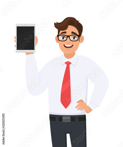 Young business man showing a new brand tablet phone. Person holding digital pad. Male character design illustration. Modern technology device, gadget, lifestyle concept in vector cartoon style.