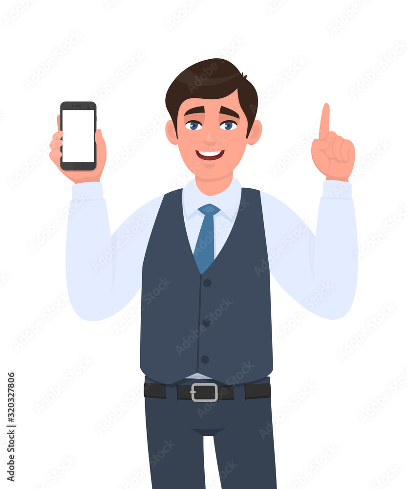 Young businessman in vest suit showing a blank screen mobile phone and pointing finger up. Person holding white display smartphone for mock up template. Male character illustration in vector cartoon. Young businessman in vest suit showing a blank screen mobile phone and pointing finger up. Person holding white display smartphone for mock up template. Male character illustration in vector cartoon.