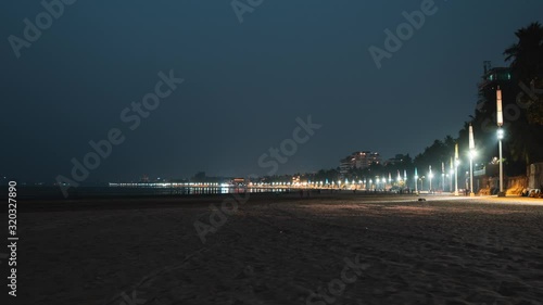 Timelapse of dusk falling over Juhu beach Mumbai photo