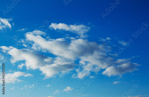 Beautiful feather clouds on blue sky as background