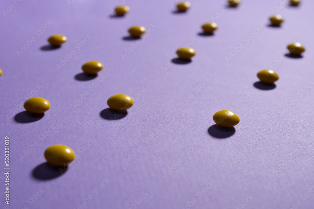 Chocolate peanut candies in yellow sugar shell. Chocolate peanut candies in yellow sugar shell.